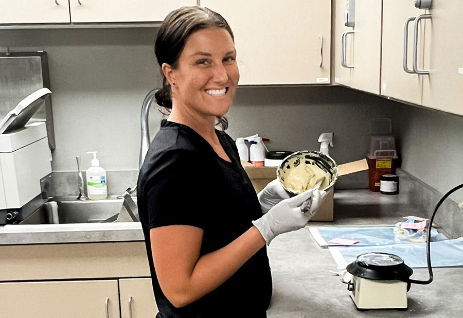 mixing-dental-impression-mold Dental assistant mixing a dental impression mold