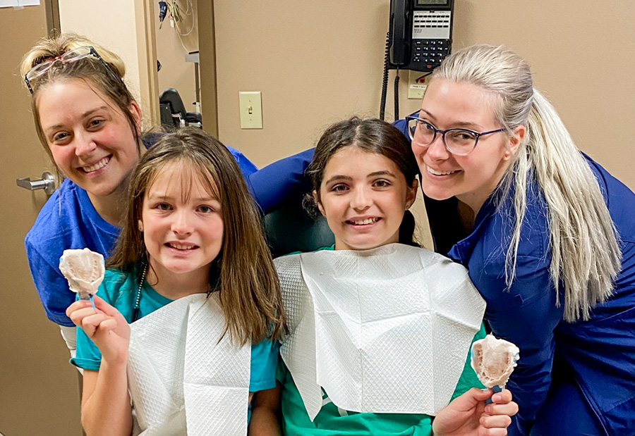 staff-with-kids-and-dental-impressions Staff with kids and their dental impressions